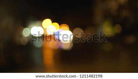 Background Plate of Bokeh out of focus lights on city street during rain storm