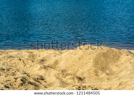Rustic sandy beach by the river