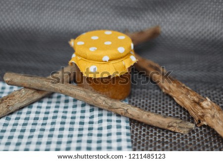 Jam in a jar on a checkered tablecloth