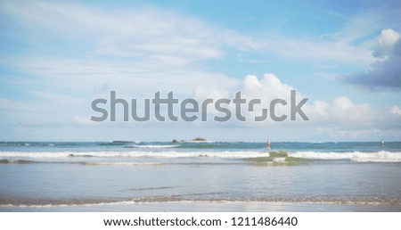 Scenic daytime shot of two tourists paddling boarding on tropical beach