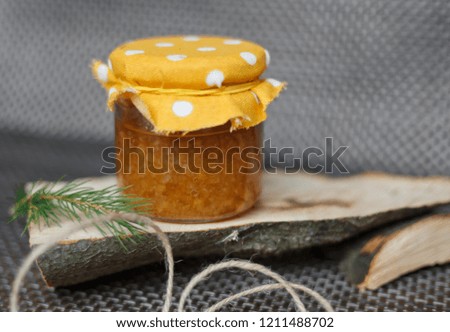 Orange jam on wooden sticks
