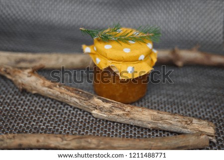 Orange jam on wooden sticks