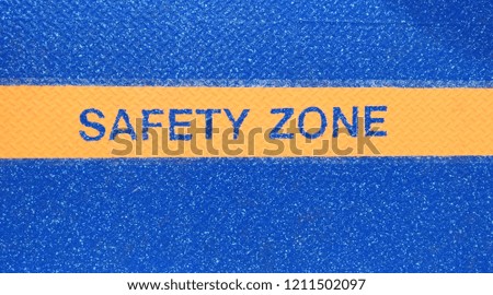 Safety zone sign on the floor.