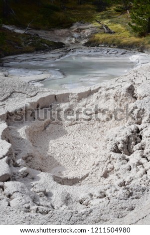 Boiling and bubbling mudpots at artists paintpots by the grand loop road at Yelleowstone National Park, USA