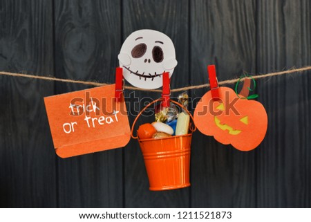 homemade halloween garland of pumpkins, skull and bat. Holiday card 