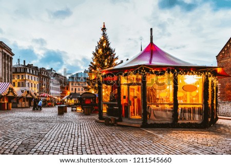 Bright pavilion at Dome square in Christmas market in winter Riga in Latvia.