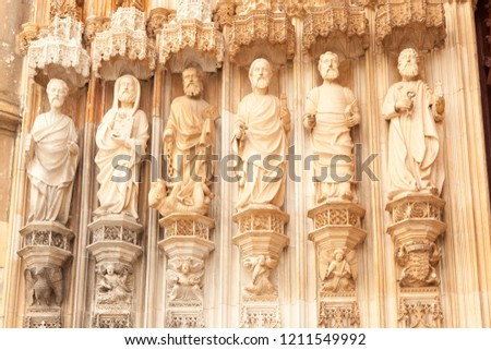 Statues of the Apostles of the main entrance portal to the Dominican abbey church of Batalha. The statues of the apostles on the facade of the Santa Maria da Vitoria, Batalha, Estremadura, Portugal.