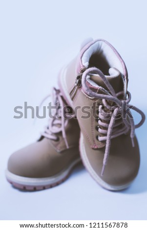 baby shoes on gray background 