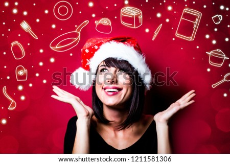 photo of the beautiful young woman in hat looking at the pictures
