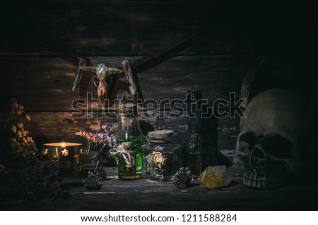 Magic potion on magic table background. Witchcraft concept.