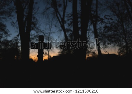 Halloween design background. Graveyard at night. Old Spooky cemetery, silhouette of crosses, minimalistic