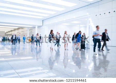 blurred business people at a trade fair