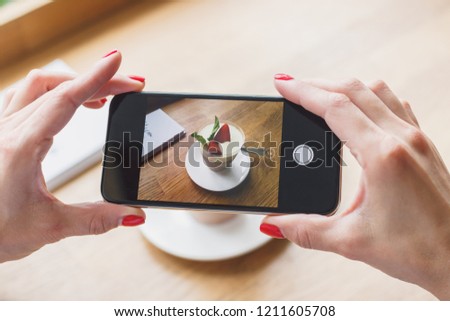 Coffee dessert with strawberry and leaves of mint, soft focus background