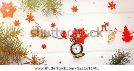 Christmas toys, snowflakes, clock and jewelry with notes and treble clef. the long format creative ideas
