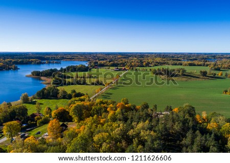 Katrineholm Sweden. Beautiful nature and landscape photo of colorful autumn day in Scandinavia. Nice outdoors image. Calm, peaceful, joyful and happy picture. Shot with drone from above.