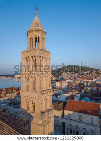 Morning light over the city of Split, Croatia, illuminates the bell tower of cathedral of St Dominus. Panoramic picture showing the old town, looking out over the Brac channel and the Adriatic coast.
