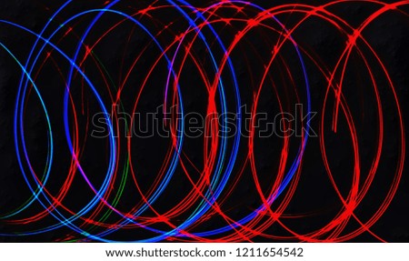 abstract texture light neon painting colorful letter free movement with pattern red and blue color long exposureshot on black background