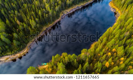 very beautiful reflection of clouds in a river in the middle of northern taiga, Karelia, Russia Royalty-Free Stock Photo #1211657665