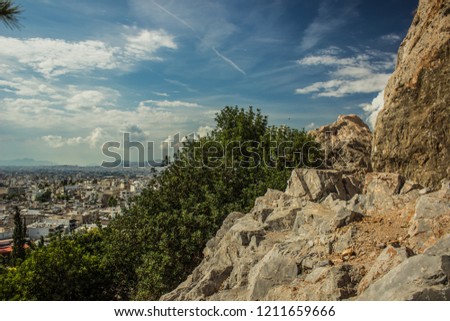 south dry rocks mountains and green plants on blue colorful sky background, good place for hiking, Greece, Thermopylae 