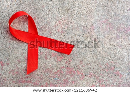 1st December, World Aids Day concept with shiny red ribbon awareness.