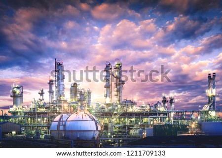 Oil and gas refinery plant or petrochemical industry on sky sunset background, Gas storage sphere tank and distillation tower in petroleum industrial Royalty-Free Stock Photo #1211709133