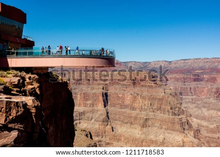 Grand Canyon National Park, West Rim, Arizona, USA. Layered bands of red rock revealing millions of years of geological history. Skywalk is a horseshoe-shaped cantilever bridge with a glass walkway. Royalty-Free Stock Photo #1211718583