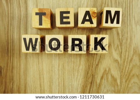 teamwork word made from wooden cubes with letters alphabet