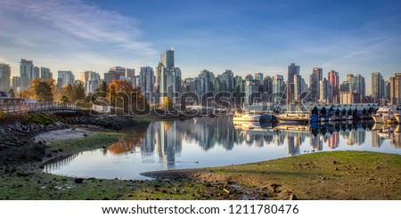 Stunning cityscape view of Vancouver skyline and Burrard Inlet from Stanley Park at sunrise in autumn, Vancouver, British Columbia