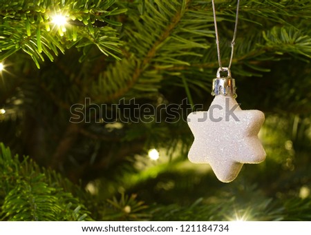 christmas star hanging on the christmas tree