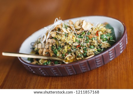 Thai cuisine rice dish in fancy bowl close up