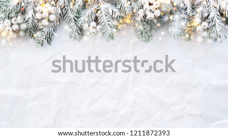 Christmas background with xmas tree on white creased background. Merry christmas greeting card, frame, banner. Winter holiday theme. Happy New Year. Space for text. Flat lay