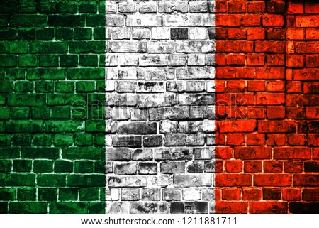 National flag of Ireland on a brick background. Concept image for Ireland: language , people and culture.