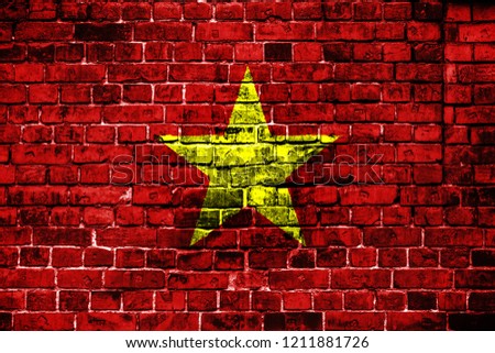 National flag of Vietnam on a brick background. Concept image for Vietnam: language , people and culture.