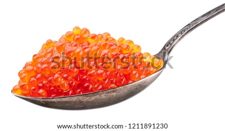 Spoon full of red caviar on white background. Macro picture. File contains clipping path.