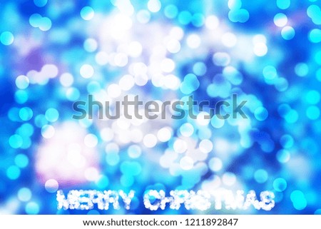 Lights on blue bokeh background. Christmas background.
