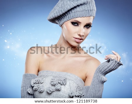 beauty winter girl on the blue  background