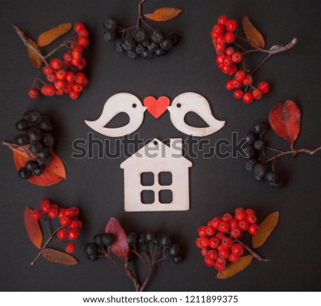 love,happy housewarming card/two wooden birds with heart,wooden house in frame of autumn berries