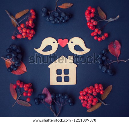 love,happy housewarming card/two wooden birds with heart,wooden house in frame of autumn berries