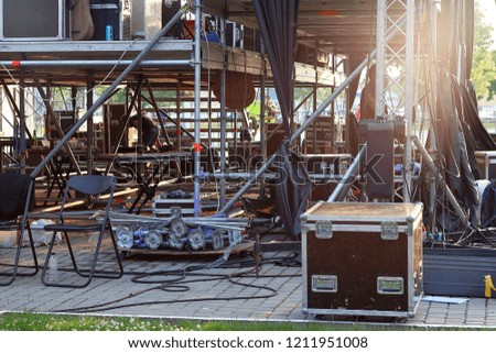 Stage equipment on outdoor stage before concert. Preparing the stage for a concert in the open air