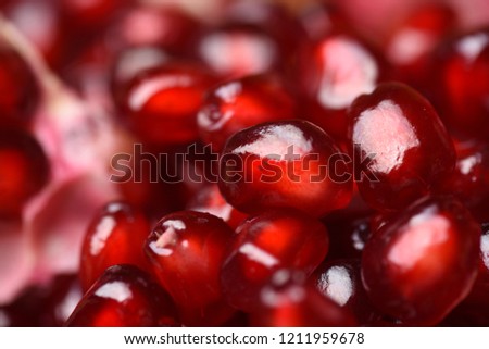 Photo of ripe pomegranate on wooden background