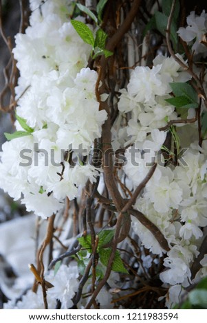 The composition of artificial flowers, imitating a real bouquet. Used for decoration and interior design.