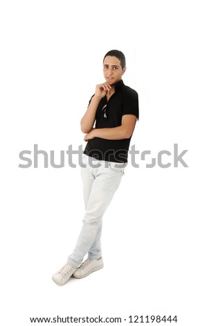 Serious arabic guy standing against the wall isolated