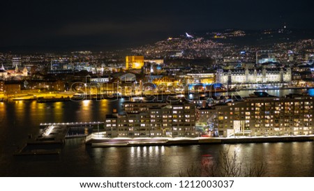 Oslo harbour with new family homes at night. The photo was taken from the Ekeberg hill.