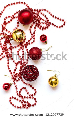 Christmas still life on white concrete background. Fir tree toys and decorations. Top view, copy space.