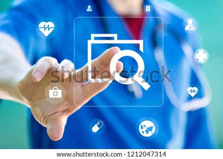 Doctor presses button file search folder on virtual electronic user interface.