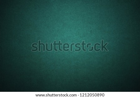 Green paper, a sheet of dark green shaded cardboard for background