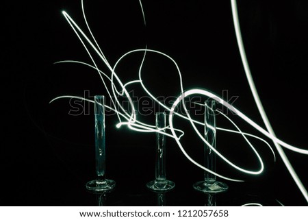 Chemical tubes isolated on black background lit with flash light.