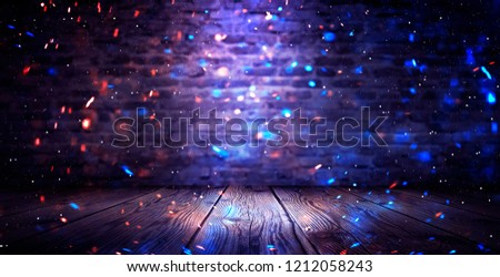 Dark basement room, empty old brick wall, sparks of fire and light on the walls and wooden floor. Dark background with smoke and bright highlights.
neon lamps on the wall, night view.