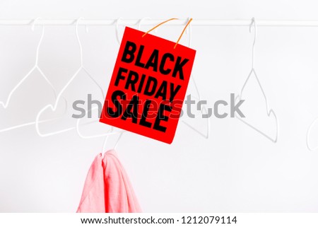 Black friday sale label, with empty hangers