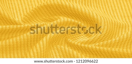 Background texture, pattern Fabric warm wool with a stitched yellow thread. Show your real stripes with our yellow wool knitted. Possessing bright, eclectic colors, exudes a bohemian look.